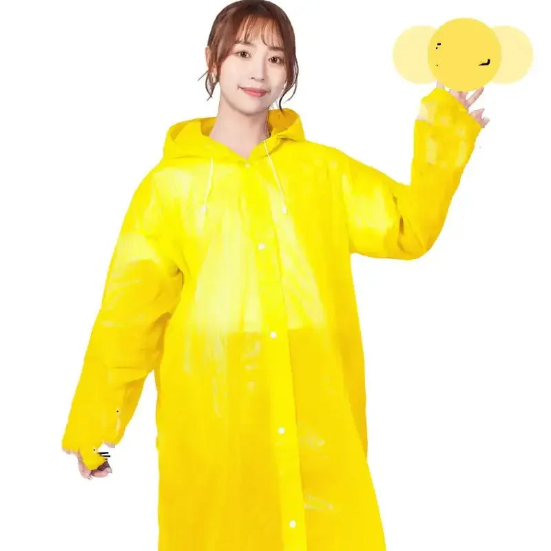 Woman wearing bright yellow raincoat, hooded, for camping and hiking gear by Hacksoutdoors