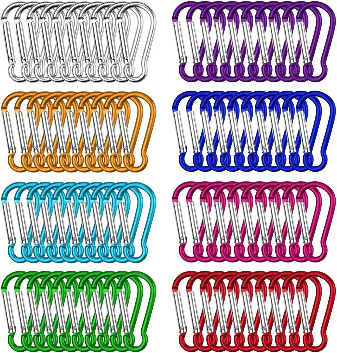 Colorful assorted aluminum carabiner clips for camping, hiking, and outdoor gear organization